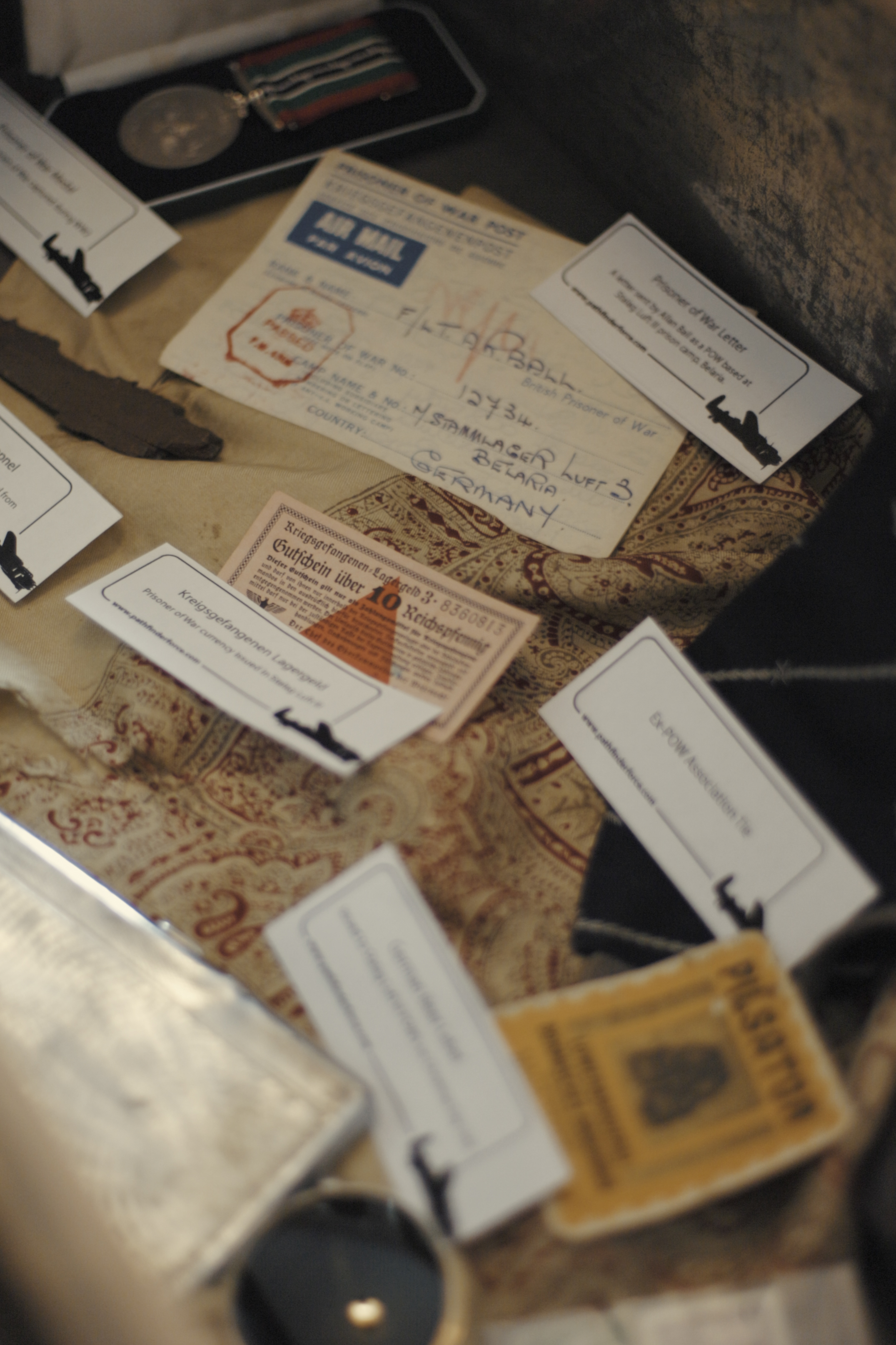 Image shows paper cards and letters with writing on them.
